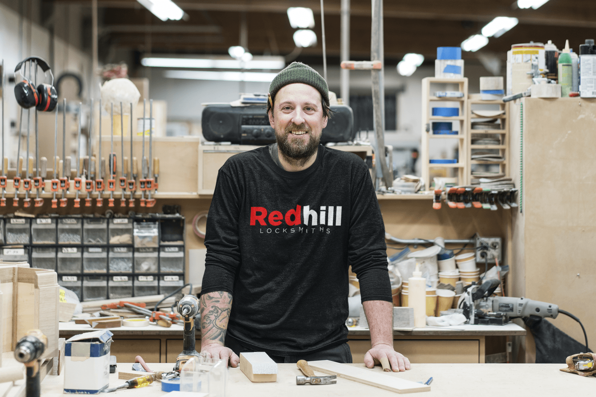 Redhill Locksmiths ltd emergency locksmith employee standing in his uniform