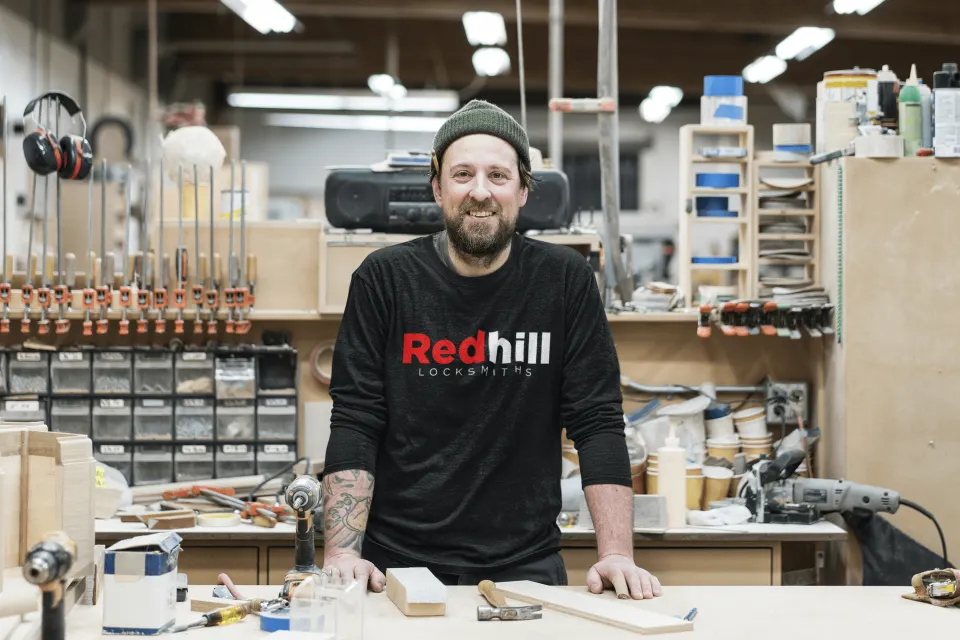 Redhill Locksmiths ltd emergency locksmith employee standing in his uniform